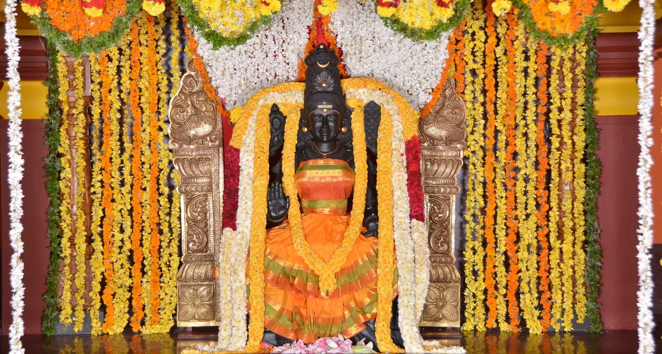 Sree Bagalamukhi Devi at the sanctum during morning archana, garlanded with jasmine and marigold